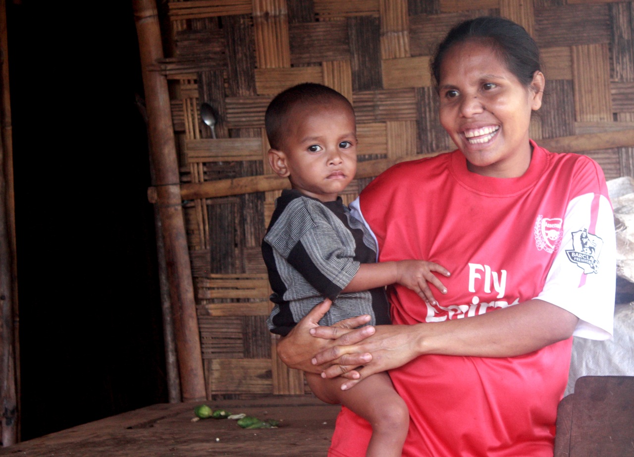 A woman and child at home in the mountains of Timor-Leste