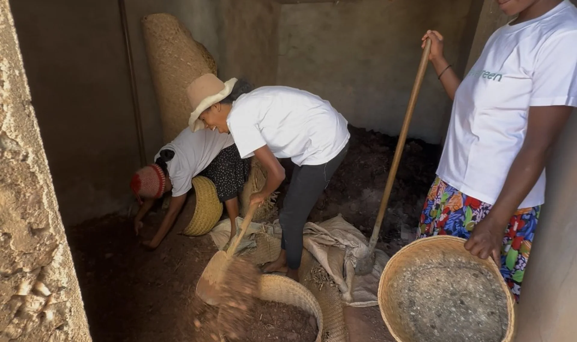 The local Malagasy planting team digging holes for native highland tree seedlings