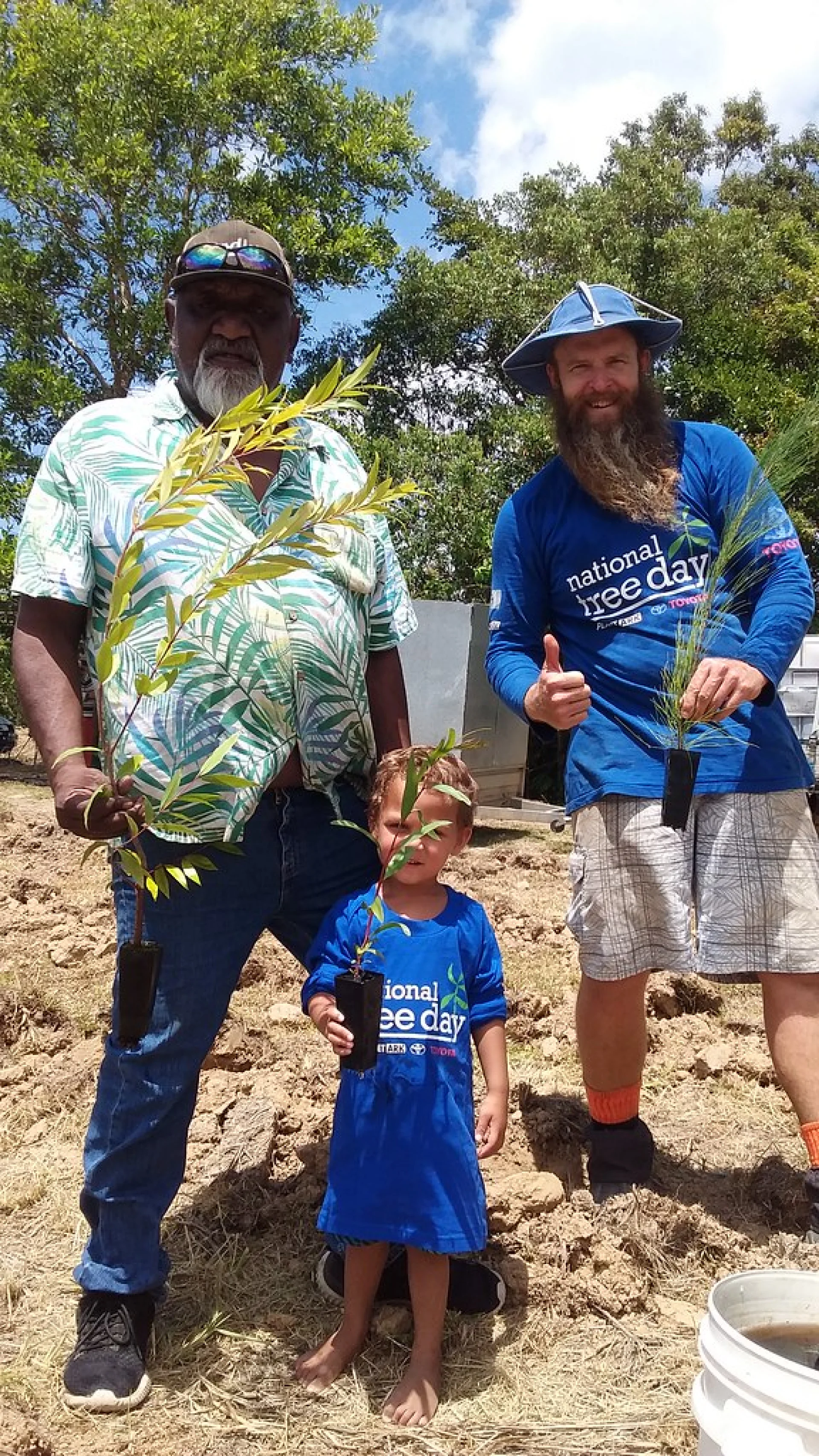 The local Malagasy planting team digging holes for native highland tree seedlings